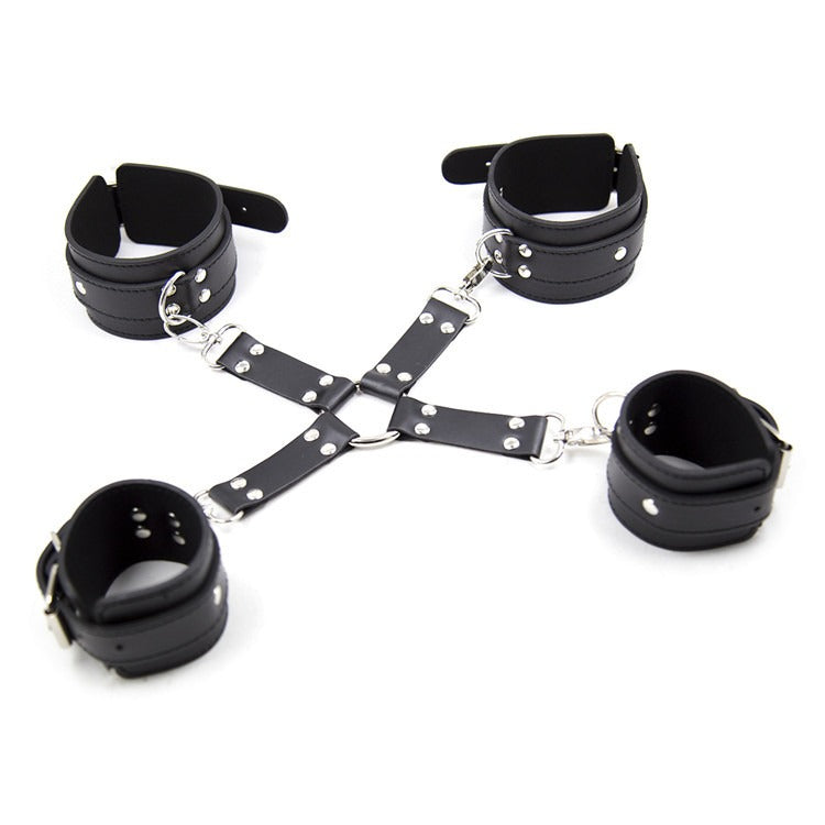 Leather cross handcuffs and foot cuffs for BDSM bondage