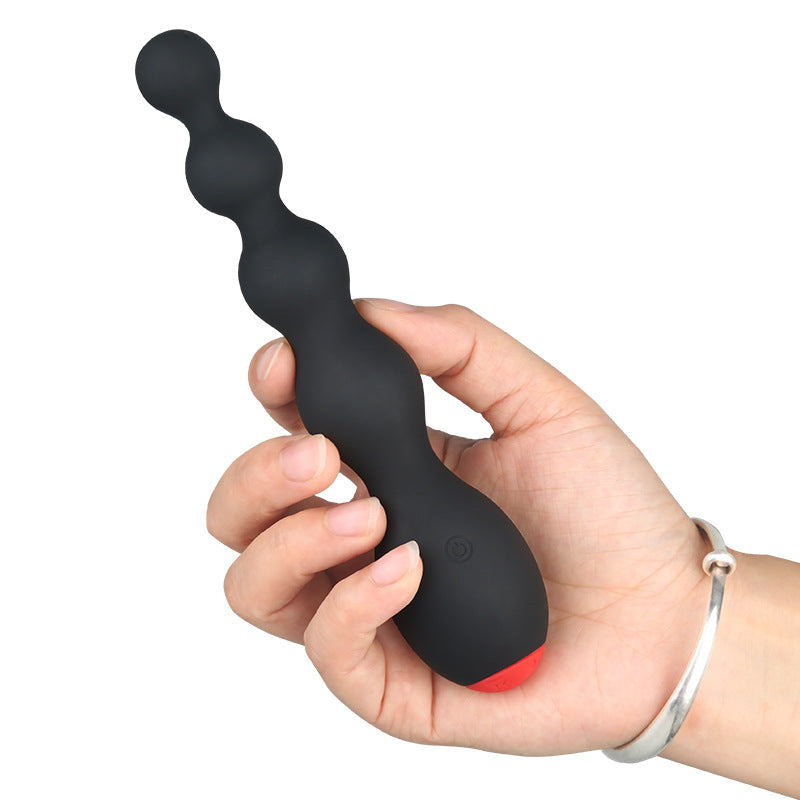 Prostate vibrator with multi-frequency settings and posterior pull beads for male G-spot stimulation.