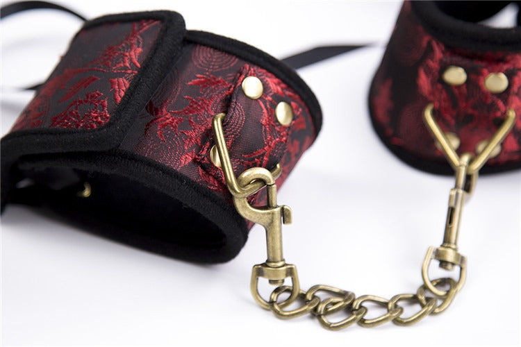 Elegant gold and red handcuffs for BDSM roleplay and restraint